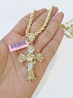 We present You with This Absolutely Stunning Real 14k Yellow Gold Rope Chain with Jesus Swirl cross Charm 4mm 24 inches. It has a detailed cut with a very good finish. These Beautiful Chain and Pendant will not tarnish, discolor, or fade because they are Pure 14K Gold. Please feel free to contact us if you have any queries regarding the item.   Chain: Metal:14k Gold Rope Chain Length : 24" Inch Weight: 7-8 Grams (approx.) Width: 4mm Style: Rope Charm: Metal:14k Gold  Weight : 5.5-6.5 Grams Style: Jesus Swirl Cross Charm Weight and Width are approximate ,+/- 10% expected. RETURN POLICY The item has to be in its original unworn condition and should be with the tag All the accessories have to be returned along with the item There should not be any damage on the item or the item should not be 20 Inch Necklace, Chain And Pendant, Gold Rope Chains, Charm Set, Cross Charms, Fine Jewellery Necklace, Rope Chain, Chain Lengths, Chain Length