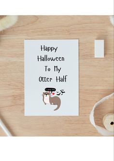 a greeting card with an otter wearing a top hat and text that reads happy halloween to my otter half