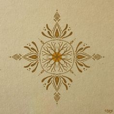 an intricate design on the side of a piece of paper