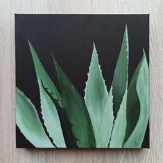 a painting of an aloea plant on a black background with green leaves in the foreground