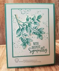 a handmade card with green leaves on it and the words, with deepest sympathy