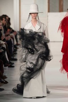 a woman's face is drawn on the runway