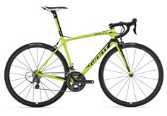 a yellow and black bike is shown against a white background with the words specialized written on it