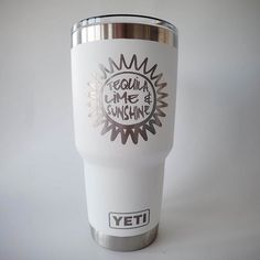 a white yeti tumbler cup with the words tequila me sunshine printed on it