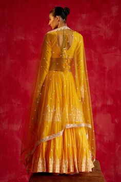 Mango yellow pleated lehenga with mirror and thread embroidery and side tassels. Paired with an embroidered padded blouse with a back tasseled tie-up and embroidered dupatta. - Aza Fashions Yellow Palazzo Set With Dupatta For Reception, Yellow Palazzo Set For Reception And Navratri, Yellow Palazzo Set With Zari Work For Reception, Yellow Palazzo Set For Diwali Reception, Yellow Palazzo Set For Reception Diwali, Yellow Palazzo Set For Reception During Diwali, Fitted Yellow Palazzo Set For Reception, Yellow Mirror Work Sets For Reception, Yellow Sets With Mirror Work For Reception