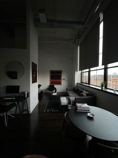 a living room with black and white decor