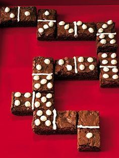 chocolate brownies with marshmallows are arranged in the shape of letters e