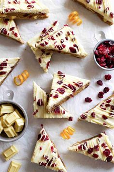 slices of cheesecake with cranberry sauce and pretzels on the side