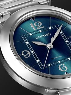 Cartier's 'Pasha' collection is as classic as it gets – the timepieces have remained just as iconic since their first release in the '30s. Updated with a sleek stainless steel case, this 41mm model has a Swiss-made calibre 1847 MC automatic movement and is accented with a blue dial featuring a distinctive sunray design. It has the signature Arabic numerals in optic white, silver-tone hands and interchangeable 'QuickSwitch' bracelet and alligator straps. For warranty information, please refer to… Luxury Blue Watch With Polished Finish, Cartier Luxury Watch With Date Indicator, Luxury Cartier Watch With Date Indicator, Blue Classic Cartier Watch, Classic Blue Cartier Watch, Luxury Blue Watch With Diamond Hour Markers, Luxury Blue Watches With Diamond Hour Markers, Timeless Blue Cartier Watch, Luxury Blue Watches With Metal Dial