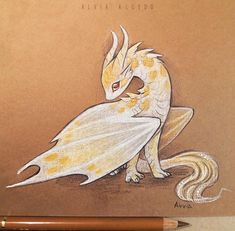 a pencil drawing of a dragon sitting on top of a piece of paper