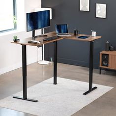 a computer desk with a monitor and keyboard on it