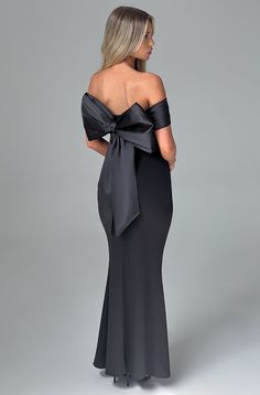 Introducing the dreamiest dress of the season, Joanna. This maxi style is cut from our luxe stretch crepe that hugs the figure and flares gently at the skirt. It has a pleated satin bardot panel neckline with stunning removable bow to the reverse. It's complete with pleats to the waist. 



Colour: Black.

Premium stretch crepe fabric.

Fully lined.

Pleated satin bardot panel on neckline.

Removable satin bow on reverse.

Asymmetric pleats on waist.

Fit and flare skirt.

Invisible zipper to the reverse.

Maxi length.

 Size: XS, S, M, L, XL, XXL Fit And Flare Skirt, Maxi Dress Sale, Maxi Styles, Dreamy Dress, Stretch Crepe, Black Maxi, Satin Bow, Formal Party, Crepe Fabric