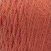 closeup of the texture of an orange woolen fabric, which is very soft