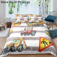 a bed with construction vehicles on it