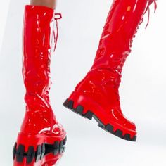 The Azalea Wang On The Run Flatform Boot In Red Is Is A Patent Leather Knee High Boot Featuring A Chunky Outsole And Rounded Toe. Complete With A Lace Up Fit And A Classic Inner Ankle Zipper Closure. Pair With All Black And A Red Lip For A Complete Look. -All Man-Made Materials - Rounded Toe - 18.5” Shaft Height, 2.25” Flat Chunky Sole Red High-top Platform Boots For Party, Red Platform Boots With Red Sole For Party, Lace-up Patent Leather Boots With Lug Sole, Red Platform Boots With Reinforced Heel For Party, Trendy Red Platform Boots For Spring, Trendy Platform Boots With Red Sole And Round Toe, Trendy Red Platform Boots With Round Toe, Fall Red Platform Boots With Reinforced Heel, Red High Ankle Lace-up Boots For Fall