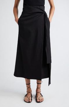 Complete your look with the effortless sophistication of this linen-blend wrap skirt. 34 1/2" length (size 34) True wrap style with side tie closure Side-seam pockets 54% linen, 38% recycled viscose, 5% viscose, 3% elastane Dry clean Imported Linen Bottoms With Tie Waist For Work, Elegant Linen Bottoms With Tie Waist, Chic Asymmetrical Wrap Skirt With Pockets, Chic Wrap Skirt With Pockets For Work, Chic Asymmetrical Linen Wrap Skirt, Relaxed Linen Asymmetrical Wrap Skirt, Chic Long Linen Wrap Skirt, Spring Linen Wrap Skirt, Asymmetrical, Linen Wrap Skirt For Spring Workwear