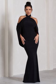 With multiple elevated details that bring the drama. Revelation is the perfect option for your next black tie event. Featuring an elegant crossed halter-neck. this black maxi dress is characterised by its open-back which flows into a captivating cape detail. Features - Premium stretch jersey- Crossed halter neckline - Open back- Sleeveless - Cape detail- Fishtail skirt- Maxi length Sizing & Fit Model is 5'8 and wears UK size 8 / US size 4 Product Information Designed exclusively by Club L London Black Halter Maxi Dress For Party, Black Floor-length Halter Dress For Gala, Black Maxi Length Halter Dress For Party, Black Floor-length Halter Dress For Night Out, Black Floor-length Halter Evening Dress, Black Floor-length Backless Dress For Prom, High Neck Black Maxi Dress For Party, Black High Neck Maxi Dress For Party, Elegant Halter Neck Maxi Dress For Dinner