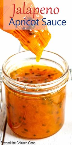 a jar filled with jalapeno apricot sauce