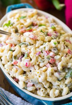 a bowl filled with macaroni salad on top of a table