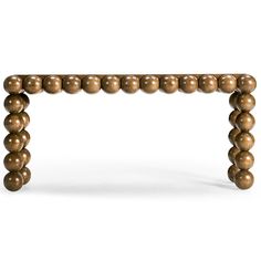 a wooden table with beads on it's legs and one leg extended to the side