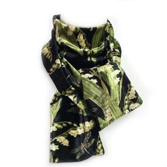 This scarf is done in our hand painted and printed Lily-of-the-Valley floral print. It has delicate lily-of-the-valley soft creamy white flowers with beautiful shades of greens in the leaves on a black background with hints of faux gold in the flower design and golden dragonflies. This scarf is a hand painted, printed, hand cut and sewn in the USA in our luminous velour all season fabric that is wrinkle free, machine washable, and travels well. This velour is extremely soft, color fast in vibran Hand Painted Scarves, Painted Scarf, Designer Scarves, Dragonflies, Lily Of The Valley, Creamy White, Infinity Scarf, Flower Design, Shades Of Green