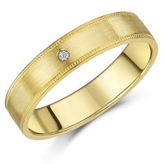 a yellow gold wedding ring with a diamond