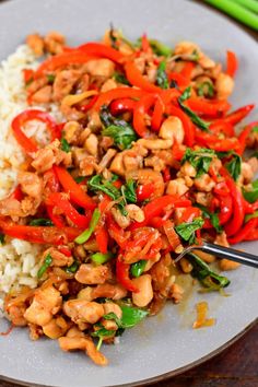 a white plate topped with rice and veggies