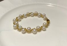 This classical bracelet is made of high-quality freshwater pearls, gold vermeil beads,  and gold vermeil magnetic bracelet clasp.   Freshwater pearls symbolize purity, harmony, and humility. It is a meaningful and gorgeous gift for you or your loved one.  I made this for myself and my toddler daughter, as well as my friends' daughters. They all love it! Product Information Pearls: 🥑Pearl Type: freshwater pearl 🥑Origin: China 🥑Shape: near round to round 🥑Size: 6-7mm 🥑Nacre: very thick, beadl Gold Pearl Bracelet With 8mm Beads, Gold Akoya Pearl Bracelet With Round Beads, Elegant Gold Pearl Bracelet With 8mm Beads, Gold Beaded Bracelets With Pearl Chain For Anniversary, Yellow Gold Beaded Pearl Bracelet, Anniversary Yellow Gold Pearl Bracelet With Round Beads, Anniversary Yellow Gold Pearl Bracelet, Yellow Gold Pearl Bracelet, Freshwater Pearl Bracelet