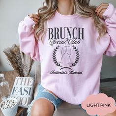 Get ready to brunch in style with our Mimosa Sweatshirt. This funny and festive shirt is perfect for Sunday brunch or any occasion where mimosas are a must. SIZING -If you are looking for an over-sized look please size up 1-3 sizes from what you normally wear. -Please see sizing chart -These are unisex shirts, this means they will have a loose fit **I do not accept returns or exchanges due to sizing issues - please reference sizing chart in product images prior to purchase PRINT COLOR & SIZING -Please be aware, the color of the print in the shirt may vary slightly from what you see on your screen due to differences in display types. Apparel is made to order using Direct to Garment (DTG) Printing therefore colors will not be as bright in comparison to vinyl - Print may appear smaller on lar Long Sleeve Graphic Print Tops For Brunch, Crew Neck Cotton Shirt For Brunch, Cotton Crew Neck Shirt For Brunch, Mimosa Shirt, Brunch Shirts, Brunch Club, Funny Drinking Shirts, Festival Shirts, Drinking Humor