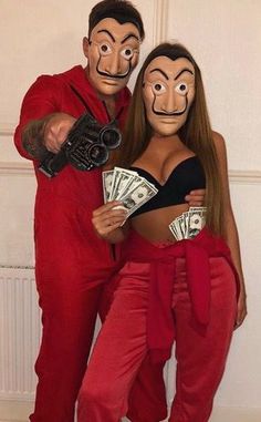 two people dressed in costumes with money and masks on their faces, posing for the camera