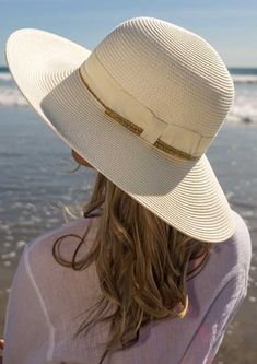 Our Charlene is gorgeous, elegant, and stylish. Enjoy carefree summer days with this sweet women's sun hat. The lightweight summer styling is enhanced with a contrasting gold shimmery ribbon band that wraps the crown and the brim's edge. A back bow provides a feminine accent. The rich cream and gold colors dress up any outfit and are sure to be a hit on the beach or just for some really great street style. The wide brim can be adjusted upwards or downwards, per your preference. We love how it pr Gold Color Dresses, Dressy Hats, Large Brim Hat, Summer Straw Hat, Summer Hats For Women, Summer Sun Hat, Sun Hats For Women, Summer Hat, Hat For Women