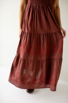 The 'Athena' dress is the perfect feminine staple to add to your closet! Easily transitioned throughout the year, the dress comes in a neutral taupe color, or a pretty merlot shade. The dress features flutter sleeves, an elastic waistband, tiered skirt, and dainty embroidered details on the front! 60% Cotton, 40% Polyester Shell 100% Polyester Lining Fully Lined Hand Wash Cold Hang or Lay Flat to Dry Do Not Bleach Low Iron If Needed Model in Merlot Height 5'9" | Wearing Size Small Model in Taupe Burgundy Cotton Dress For Spring, Spring Burgundy Cotton Dress, Athena Dress, Athena Dresses, Embroidered Details, Layered Tops, Tiered Maxi Dress, Taupe Color, Tier Skirt