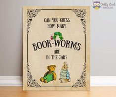 a wooden sign that says, can you guess how many book worms are in the jar?