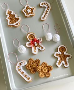 some crocheted ornaments are on a tray