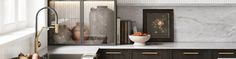 a white vase sitting on top of a counter next to a sink in a kitchen