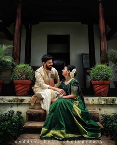 a man and woman sitting on the steps together