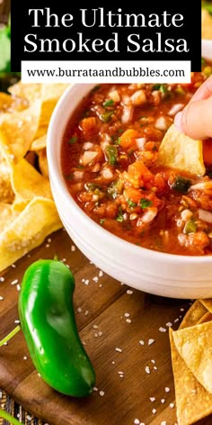 a person dipping tortilla chips into a bowl of salsa with the text overlay