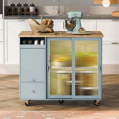 a kitchen cart with baskets on top of it