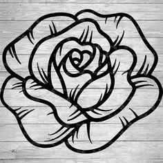 a black and white drawing of a rose on wood planks with the word love written in it