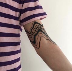 a person with a tattoo on their arm