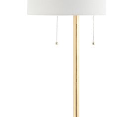 a gold lamp with a white shade on it