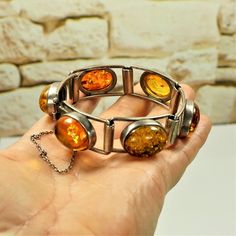 Bold AMBER 925 SILVER Heavyweight BRACELET, Rare To Find Modernist Jewelry, Gift for Her by ANTIQUE4YOU BALTIC AMBER SILVER, Amber panel bracelet, Sterling BRACELET, Old Estate Jewelry, Heavy Amber Bracelet, Multi Stone Bracelet, Hinged bracelet, Unisex Gift Idea AMAZING COMPOSITION OF 6 3D OPTIC DIFFERENT COLORS GENUINE AMBER OVAL STONES PLACED IN ARTISTIC STERLING SILVER FRAME.  SECURED CLOSURE WITH CHAIN. HALLMARK 925. 3/4" wide. In new conditions. LENGTH OF BRACELET 7.5".   HEAVYWEIGHT. UNIS Old Estate, Silver Link Bracelet, Modernist Jewelry, Sterling Bracelets, 925 Silver Bracelet, Amber Bracelet, Unisex Gift, Hinged Bracelet, Amber Jewelry