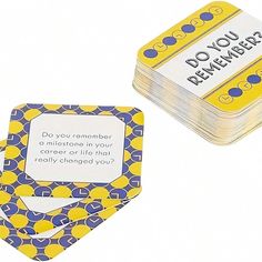 a stack of yellow and blue coasters sitting next to each other on top of a white surface