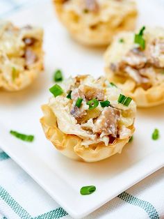 small appetizers are sitting on a white plate