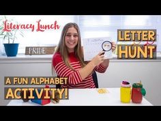 a girl is holding up a letter hunt activity in front of her desk with the words,