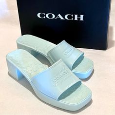 Coach Scarlett Rubber Block Heel Sandals Size 10 Sea Mist (Green/Blue) These Cute Block Heel Rubber Sandals Will Be Your Go-To-Sandal For The Warmer Months: - Rubber Material, With A Gloss Finish - Textured Coach “C” Logo Footbed - Ridge Soles - Square Toe - Single Strap With Coach Badge Logo Embossed On It - Heel Height Approximately 2.25”; Platform Approximately 1” - Color: Sea Mist (This Is A Pale Green/Blue Color) - Size Is 10 **Warning: These Are My Original Pictures And Listing And Are Not Coach Closed Toe Heels For Spring, Coach Block Heel Spring Heels, Coach Block Heel Heels For Spring, Coach High Heels For Spring, Coach High Heel Summer Shoes, Coach Slip-on Summer Heels, Coach Summer High Heel Shoes, Coach Sandals For Spring Formal Occasions, Designer Coach Open Toe Heels