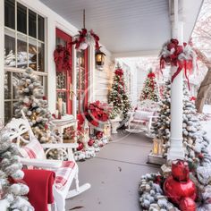 a porch decorated for christmas with red and white decorations