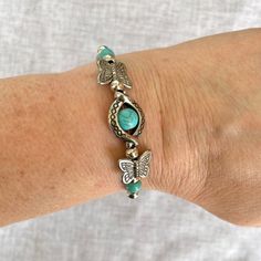 This Elegant Butterfly Bracelet Is Made From Turquoise Stone Beads And Silver Alloy, Perfect For Women. Adjustable Size From 6.5 To 9 Inches Using An Extender. Its Striking Silver And Turquoise Blue Color Combination Is Sure To Catch The Eye. Bracelet With Natural Stone And Butterflies Size: 6.5 To 9 In Approximate Measurements Can Be Seen In The Photos. Length At Shortest Link: 6.5 In / 17 Cm Length At Longest Link: 9 In / 23 Cm Condition: New With Tags Made From Turquoise, Silver Alloy, And Re Blue Color Combinations, Turquoise Blue Color, Butterfly Bracelet, Eye Bracelet, Butterfly Design, A Butterfly, Boutique Jewelry, Ladies Boutique, Color Combination