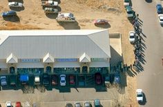 an overhead view of a parking lot with cars parked in it