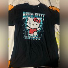 Black And Blue Hello Kitty Lightning T-Shirt In A Men’s Size Large And Medium!New And With Tag! Thank You For Looking At My Shop I Have More Sanrio And Hello Kitty As Well As Other Items Listed Black Y2k T-shirt With Cartoon Print, Y2k Black T-shirt With Cartoon Print, Black Y2k Style T-shirt With Cartoon Print, Trendy Black Shirt With Character Print, Y2k Black Hello Kitty Print Top, Y2k Hello Kitty Print Crew Neck T-shirt, Black Hello Kitty Print Short Sleeve Top, Black Y2k Shirt With Crew Neck, Black Y2k Crew Neck Shirt